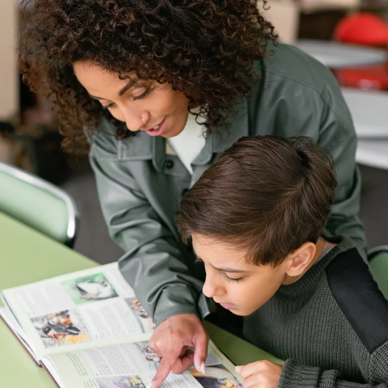 woman teaching child